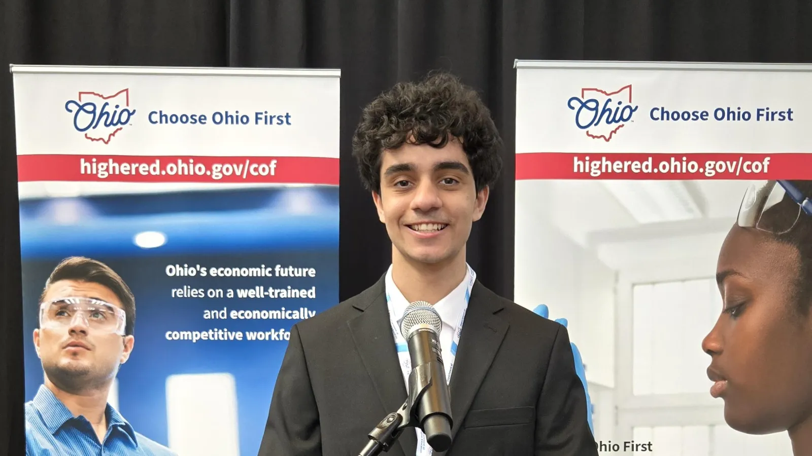 Faisal at the Ohio Statehouse podium